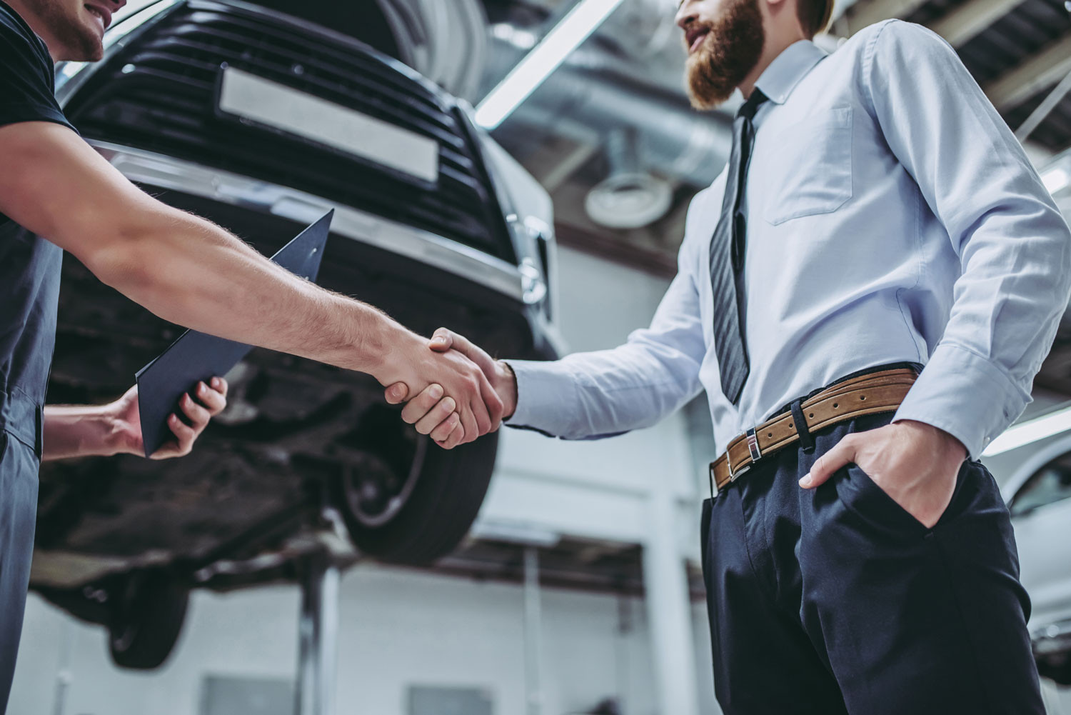 Client and Car Mechanic Handshake