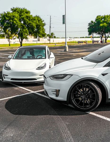 Two White Teslas In Lot