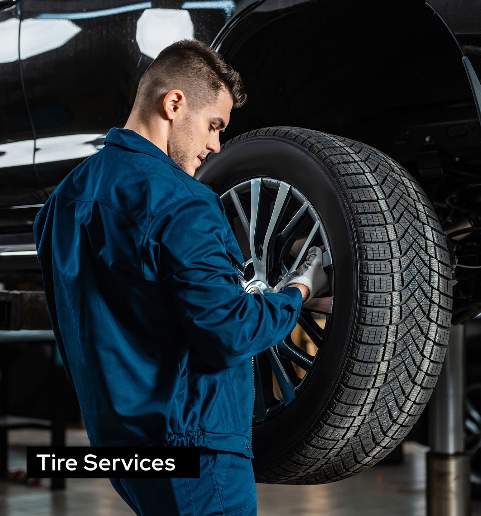 Car Mechanic Changing Tire