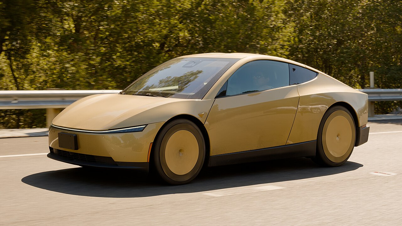Tesla Cybercab autonomous vehicle driving on the highway