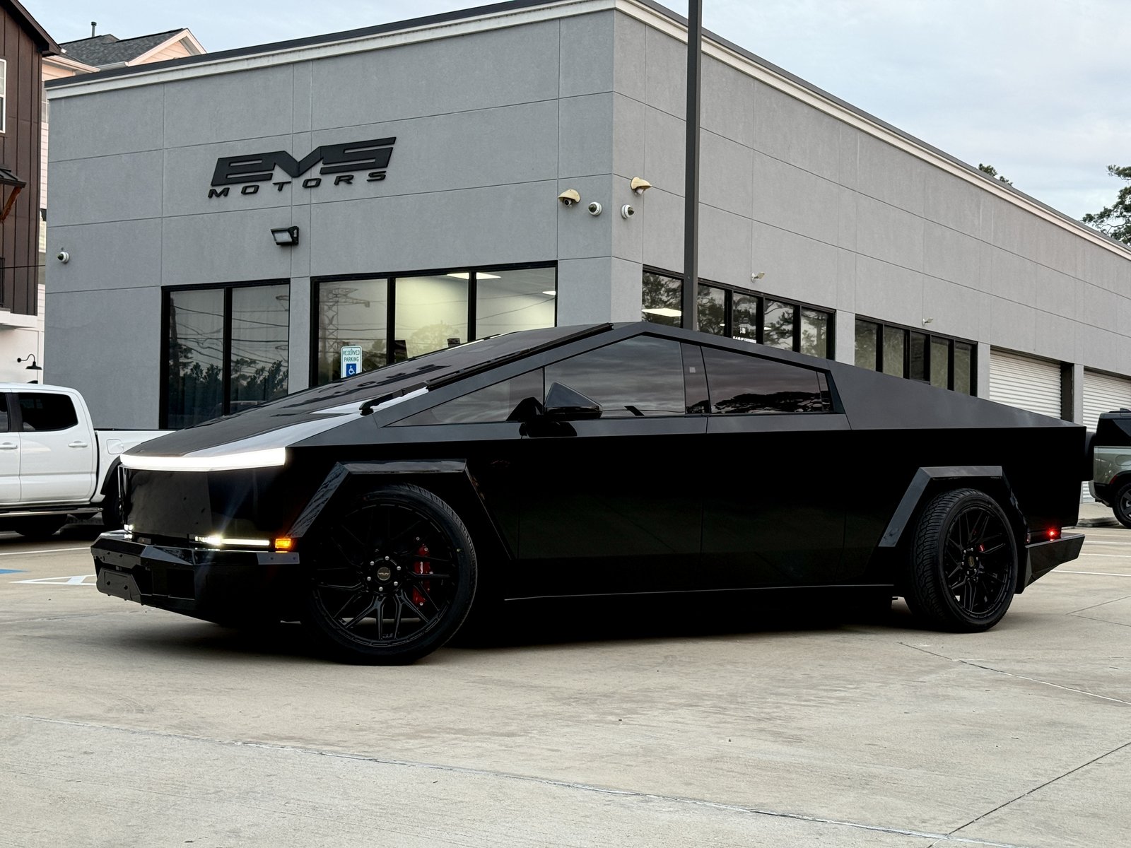 Matte black Cybertruck with red calipers and flares at EVS Motors