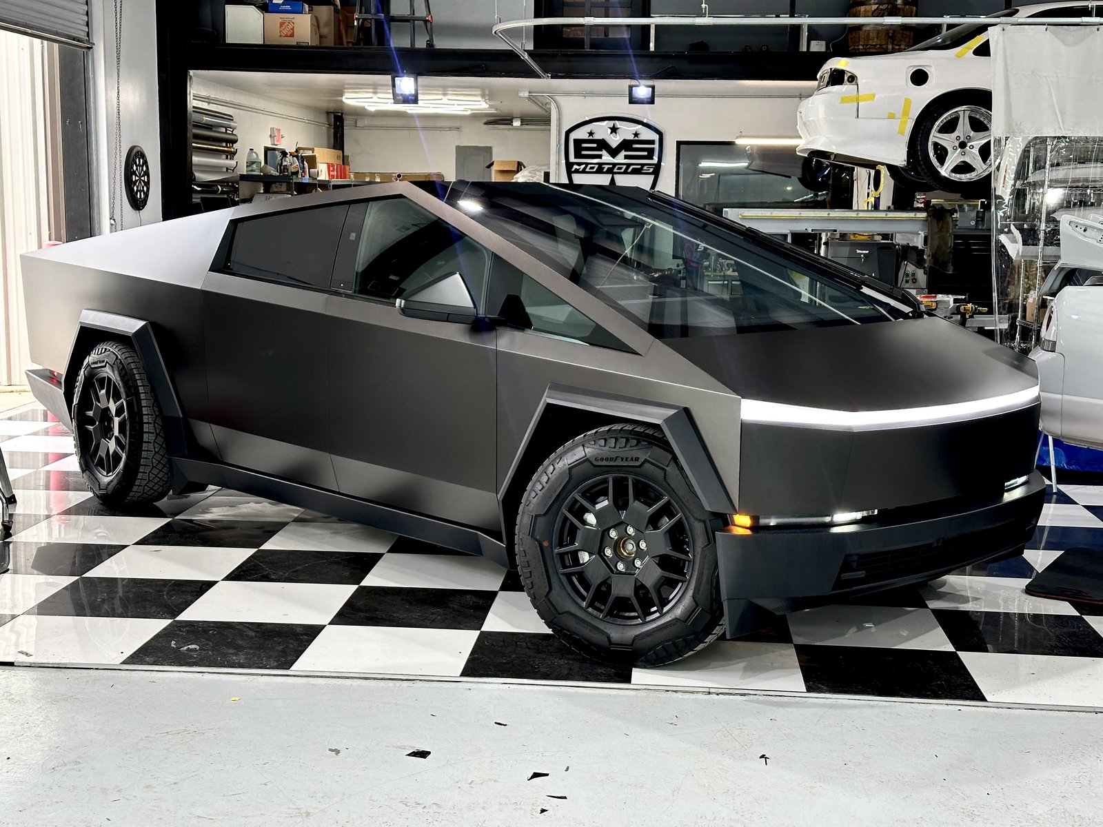 Matte dark Cybertruck with EVS shield and light bar on
