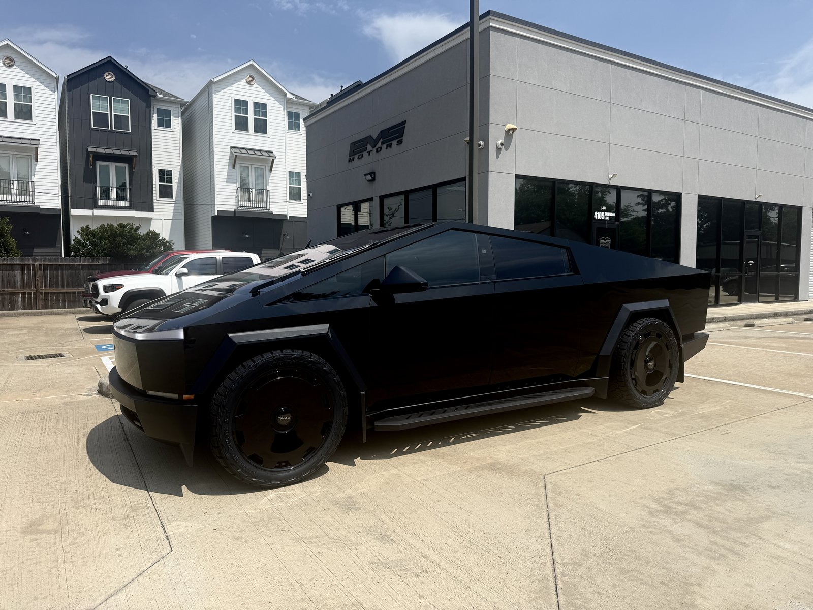 Satin black Cybertruck with tint, wheels and fender flares at EVS Motors