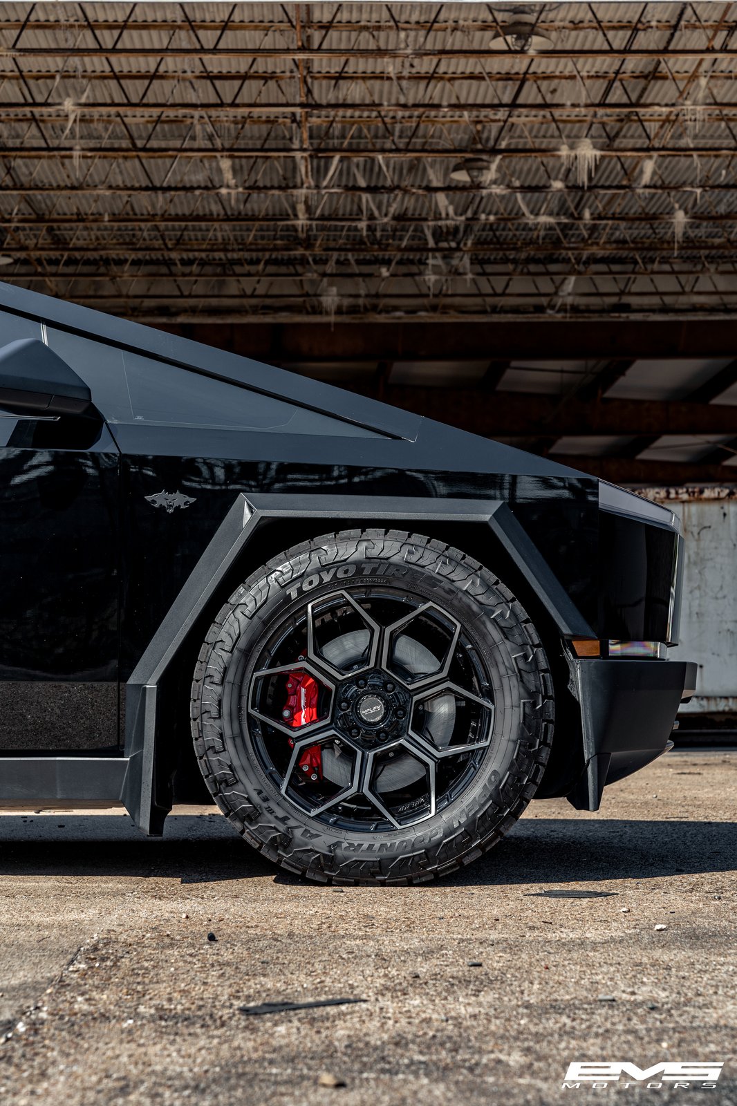 Close-up of T Sportline wheels and Toyo Open Country tires on Cybertruck