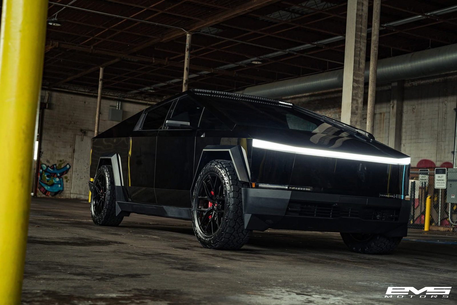 Cybertruck with roof light bar in warehouse at EVS