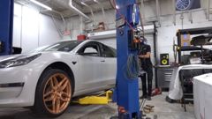 Tesla Model 3 on a lift at EVS Motors