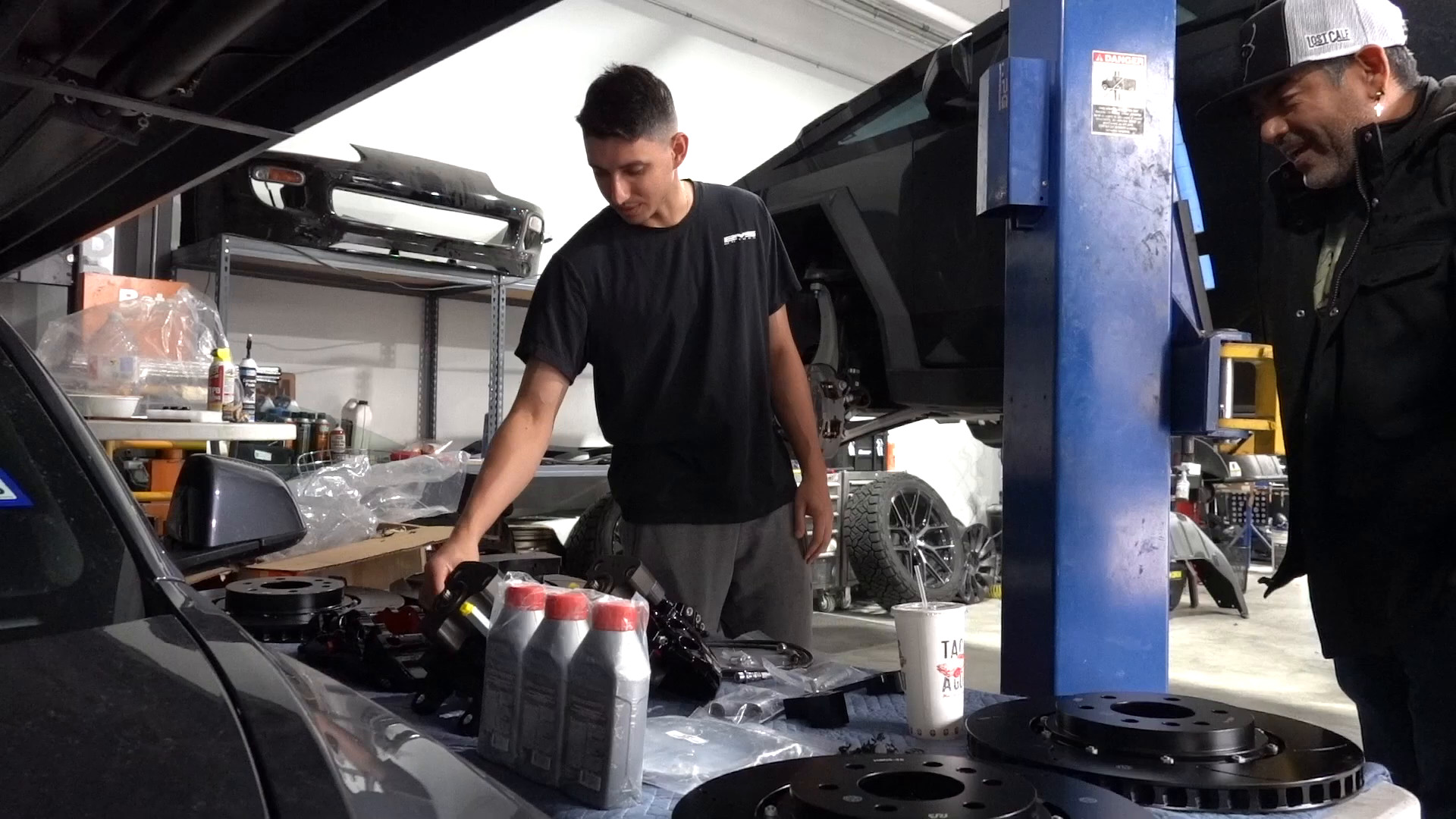 Tesla Cybertruck on a lift for brake service at EVS Motors