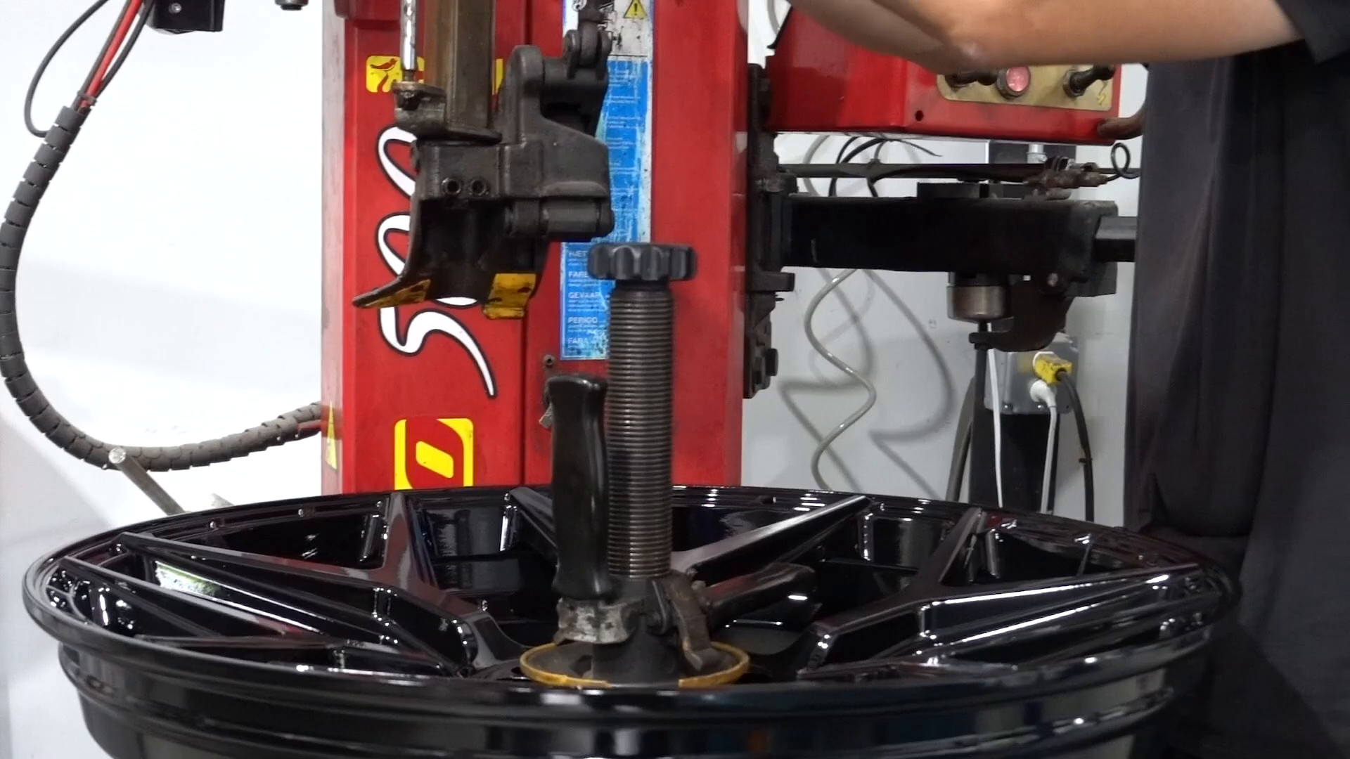 Tire being mounted on a wheel at EVS Motors
