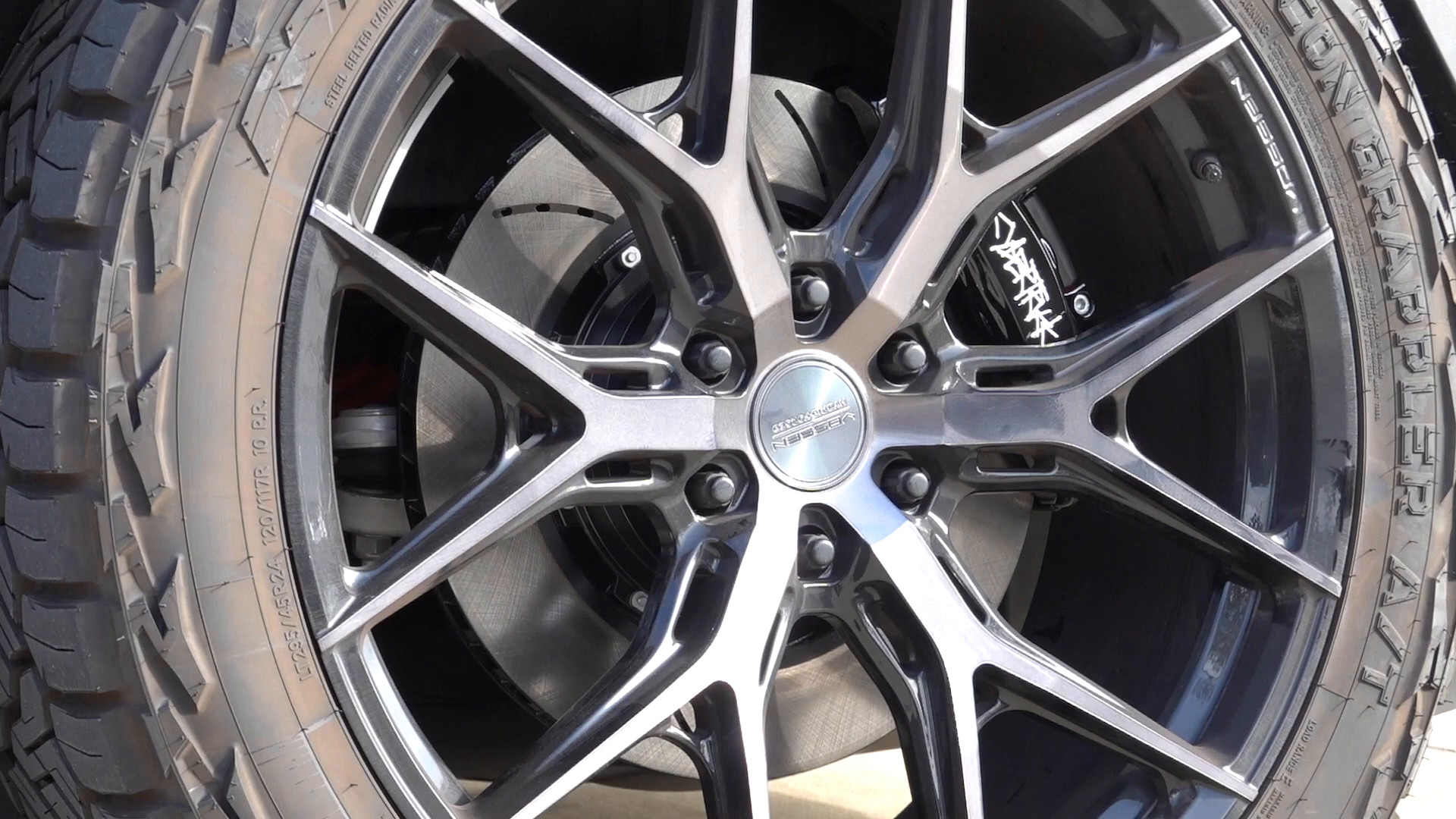 Close-up of a forged aftermarket wheel and big brake caliper at EVS Motors